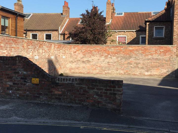 Private parking space behind the building